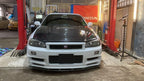 OEM Style Carbon Fiber Front Lip – Nissan Skyline R34 GTR (1999 - 2002)