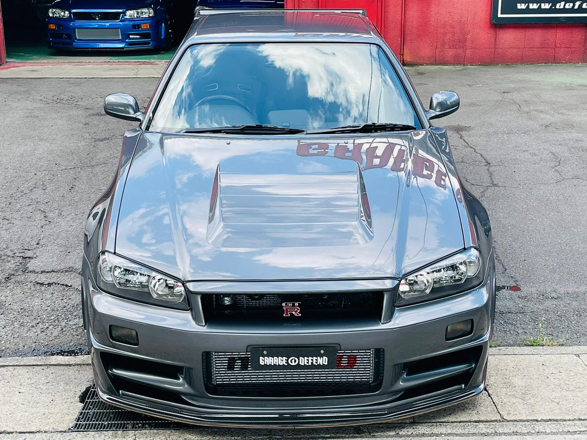 Nismo-1 Style Fiber Glass Hood Bonnet – Nissan Skyline R34 GTR (1999–2002)