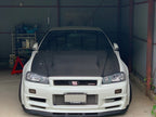 OEM Style Carbon Fiber Front Lip – Nissan Skyline R34 GTR (1999 - 2002)