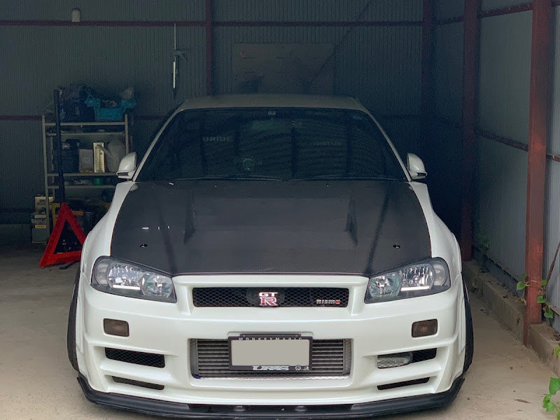 OEM Style Carbon Fiber Front Lip – Nissan Skyline R34 GTR (1999 - 2002)