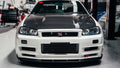 OEM Style Carbon Fiber Front Lip – Nissan Skyline R34 GTR (1999 - 2002)