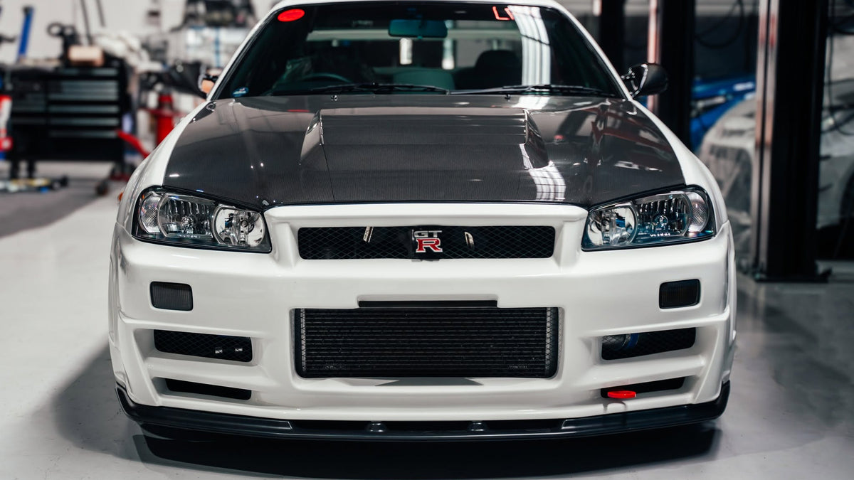 OEM Style Carbon Fiber Front Lip – Nissan Skyline R34 GTR (1999 - 2002)