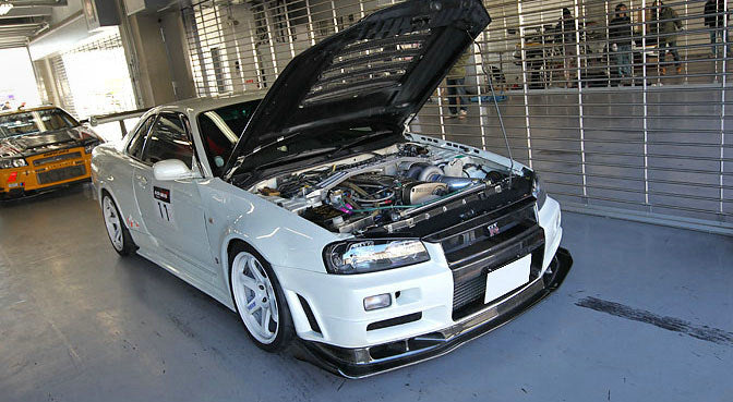 AS Style Carbon Fiber Front Lip – Nissan Skyline R34 GTR (1999–2002)
